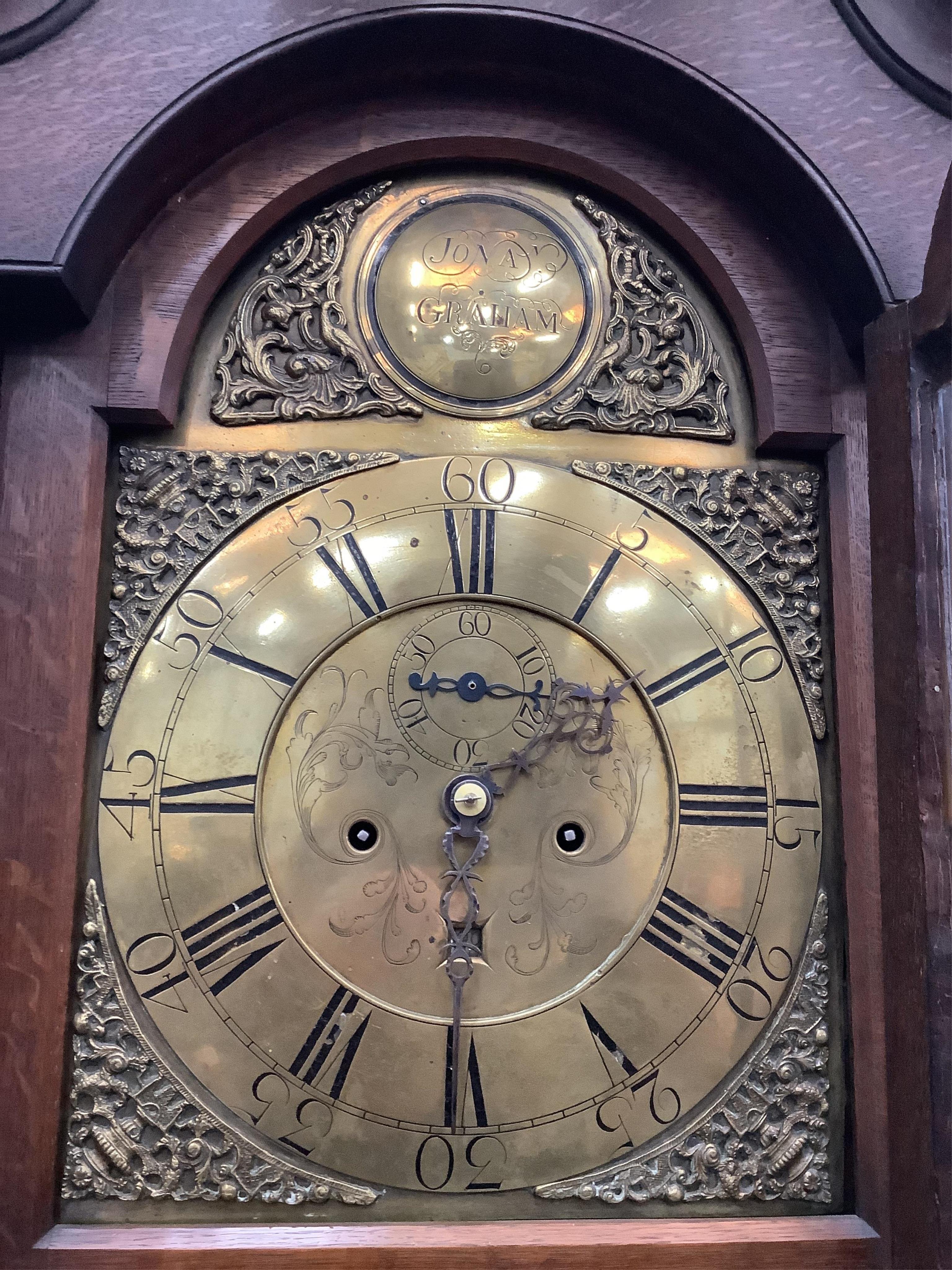 A mid 18th century oak eight day longcase clock, the brass dial signed Jonan. Graham, height 218cm. Condition - fair